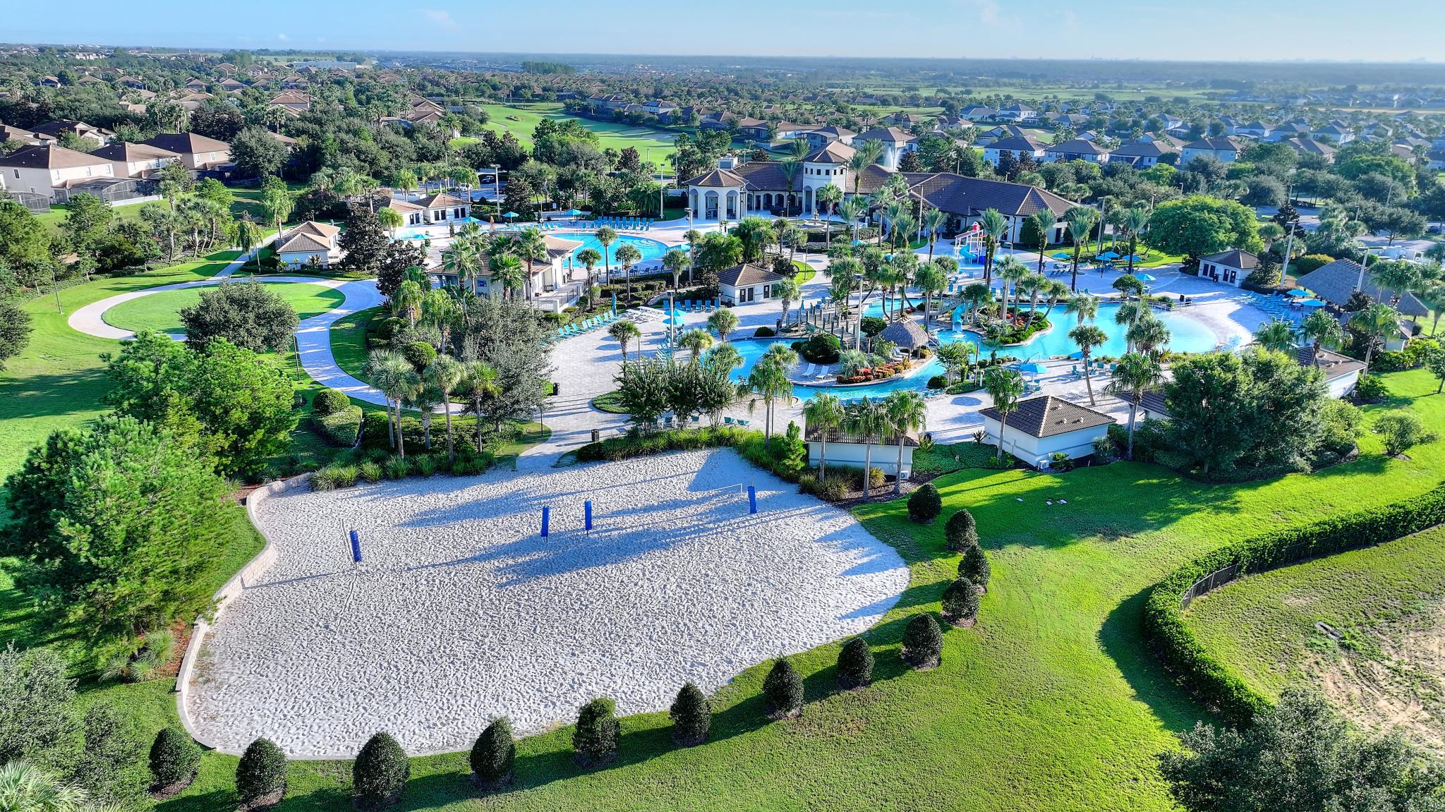 Aerial view of the Oasis Club resort grounds and sand volleyball court